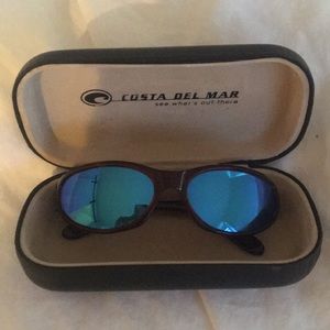 Costa Del Mar polarized sunglasses.  Blue lenses.